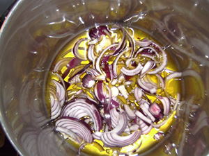 chopped onions in pot with olive oil
